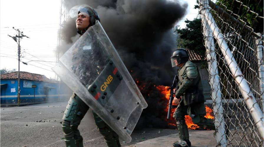 Venezuelan troops abandon posts amid violent clashes with protesters