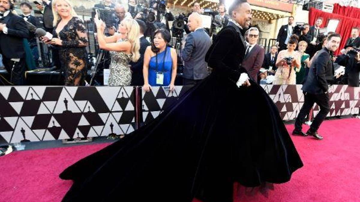 Oscars fashion Billy Porter defies tradition and steps out onto the red carpet in a gown by designer Christian Siriano