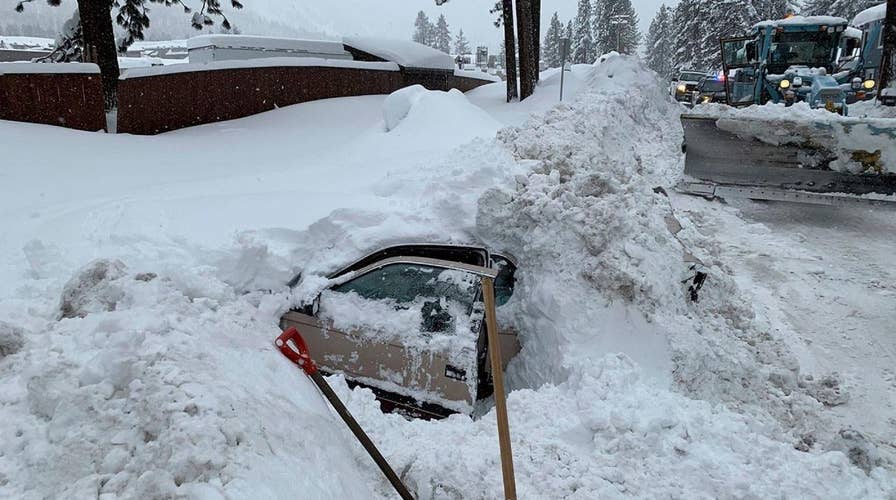 Snowplow hits buried car with woman stuck inside