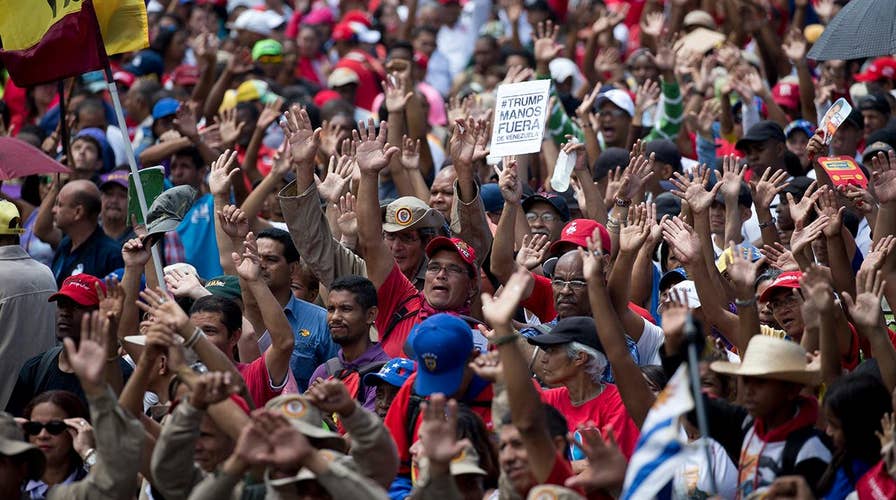 Venezuela power struggle takes on Cold War overtones as US, Russia stand on opposite sides