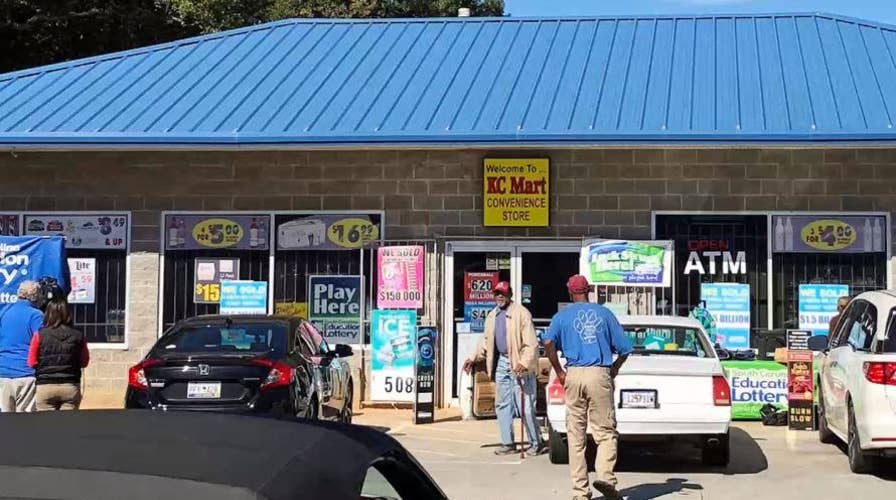 Act of kindness pays off as lotto winner collects $1.5 billion