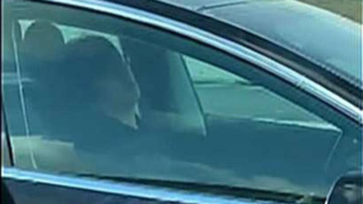 Man caught sleeping behind the wheel of his Tesla as it drives down a busy highway