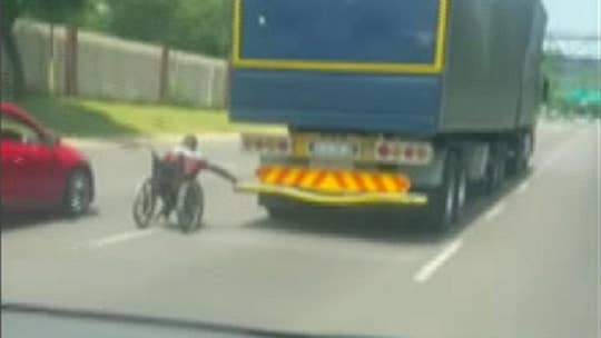 Enterprising daredevil in wheelchair hitches ride off back of South African truck in viral video