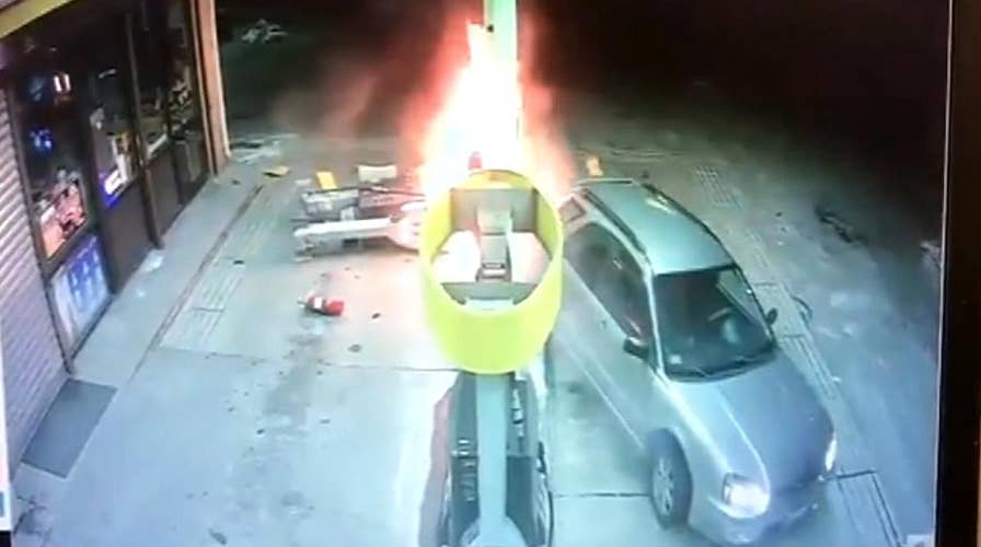 Driver starts fire at gas station after backing up into pump