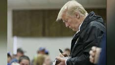 Trump gets slammed for signing Bibles for tornado survivors even though it’s an 'old tradition'