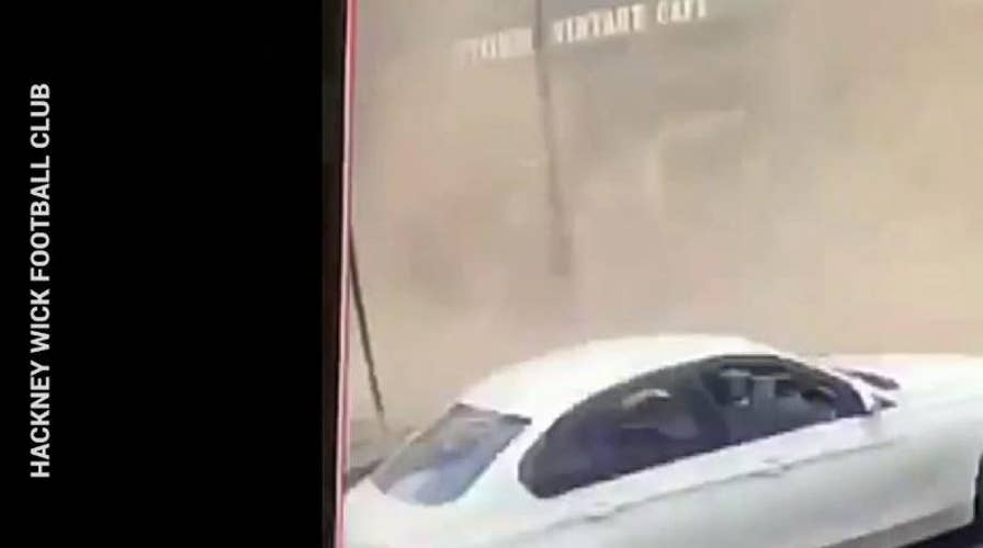 Watch: Lucky moment a man narrowly avoids being crushed by collapsing roof