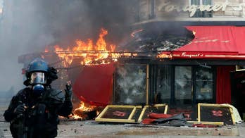 Protestors set fire to bank in Paris, France