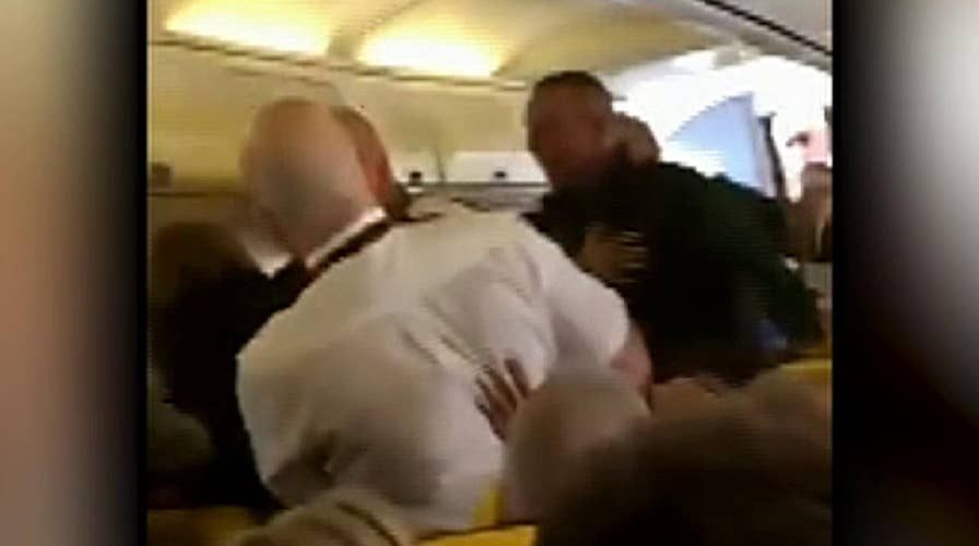 Raw video: Ryanair passengers filmed fighting mid flight