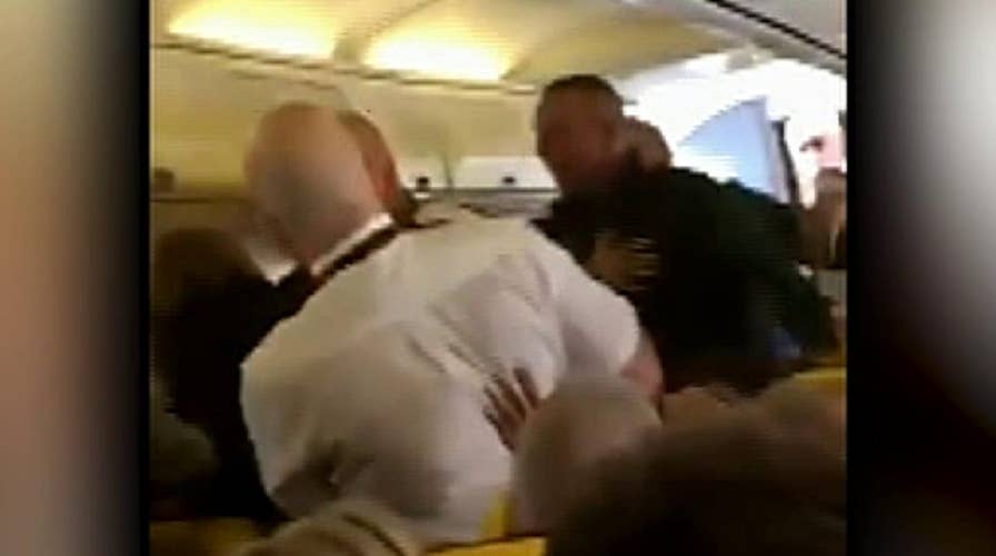 Raw video: Ryanair passengers filmed fighting mid flight