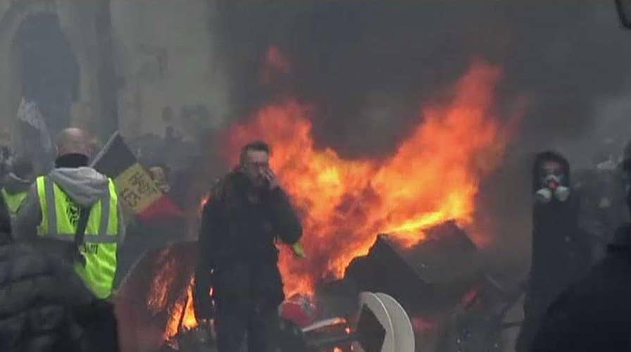 Violence returns to Paris in 18th straight weekend of protests against Macron