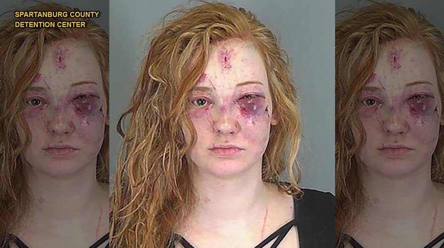 Woman arrested after tasing rival; mugshot shows she paid price