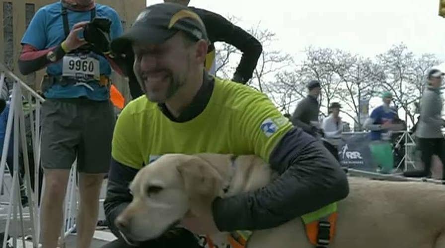 Blind runner and guide dogs make history at NYC half marathon