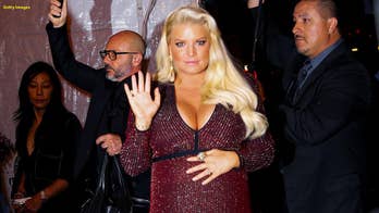 Jessica Simpson shows off baby bump in bikini as due date nears