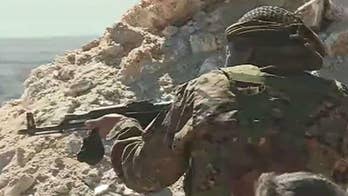 View from the front: US-backed forces fight ISIS soldiers at remaining stronghold in eastern Syria