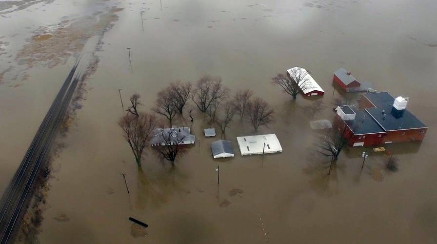 Unprecedented Midwest flooding damages famers' fields, threatens stockpiled grain and kills livestock