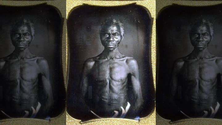 Harvard sued for 'exploiting' early photos of slaves, asked to pay damages to woman who says she's next of kin