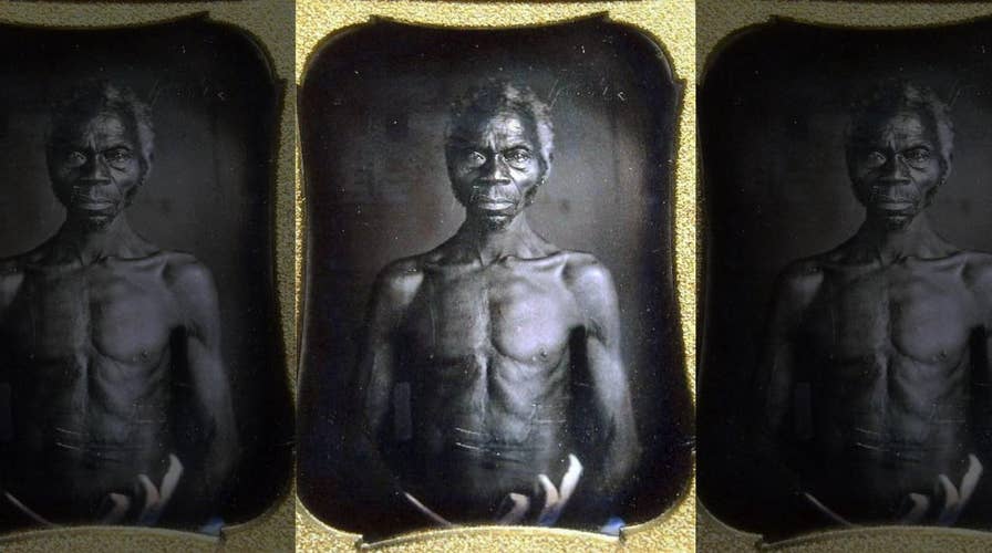 Harvard sued for 'exploiting' early photos of slaves, asked to pay damages to woman who says she's next of kin