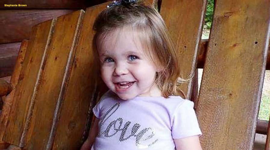 Toddler shot by stray bullet while playing in her backyard