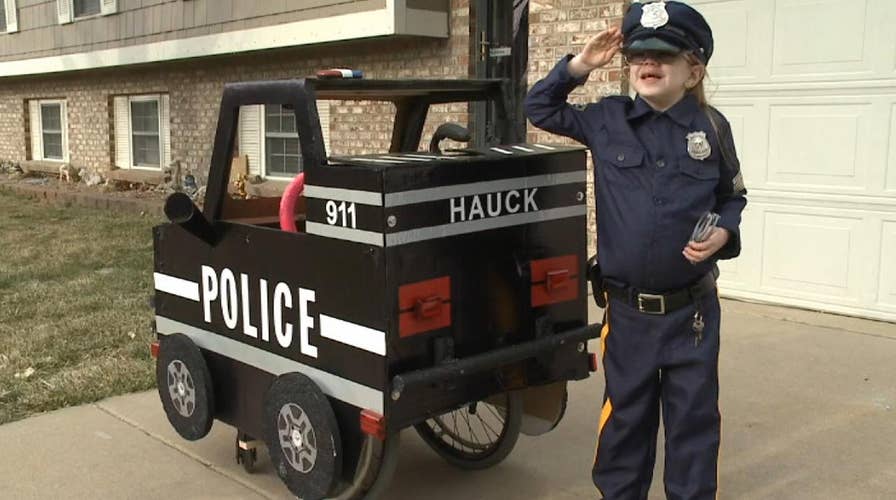 Dad converts wheelchair into police cruiser for daughter with an epileptic condition