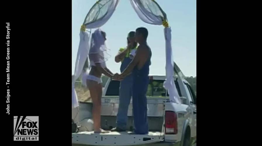 Video: Ahrielle and Jeremy Biddle say 'I do' on the bed of a pickup truck at Florida's Redneck Mud Park