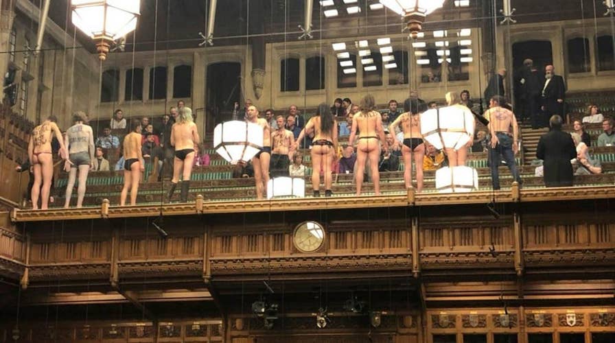 A dozen demonstrators have been arrested after stripping down in Britain's House of Commons to protest climate change