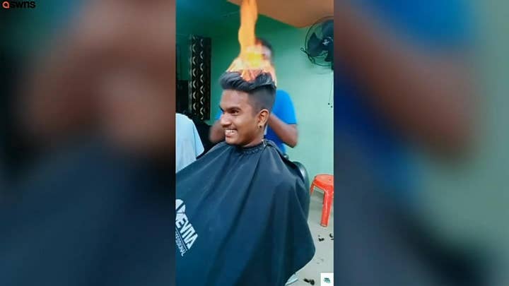 Barber lights customer's hair on fire during unbelievable haircut