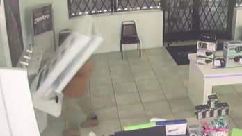 Michigan man tried to steal cellphones, entire display falls on him: video