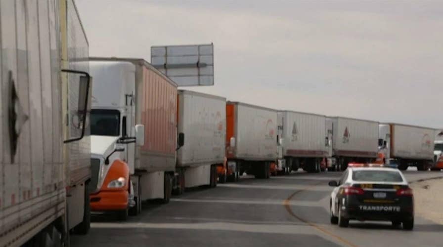 Stricter border control is leading to long delays for commercial truck drivers
