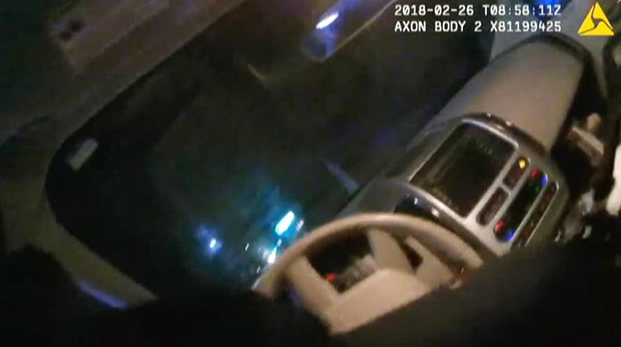 Officer dragged by car nearly a mile after suspect tries to flee traffic stop