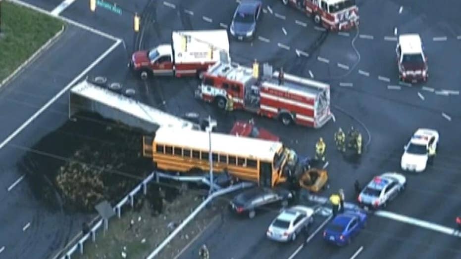 School bus, tractortrailer crash leaves at least 1 dead, several