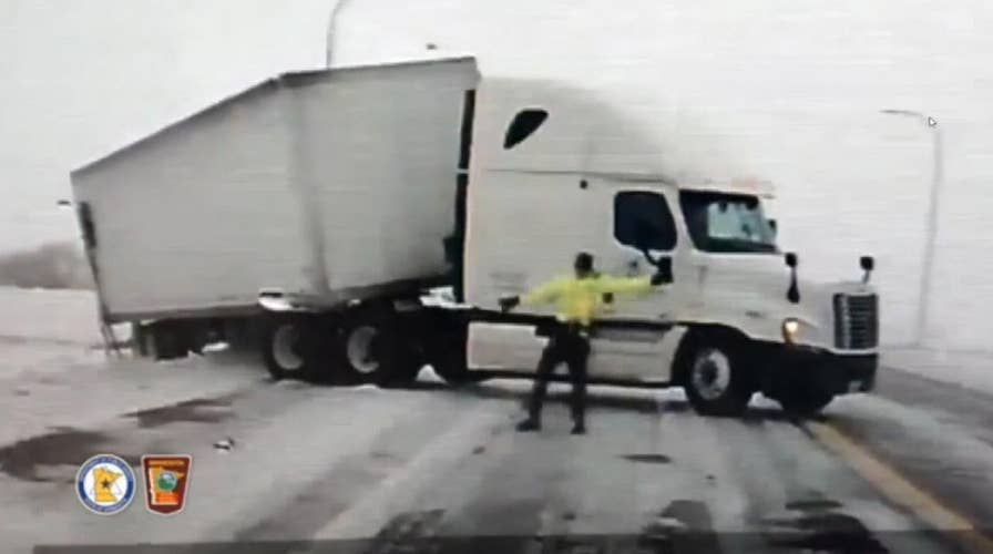Minnesota state trooper knocked to ground from high winds