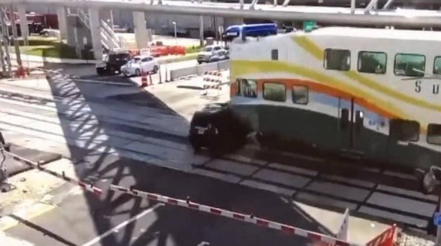 Commuter train crashes into SUV that drove onto tracks