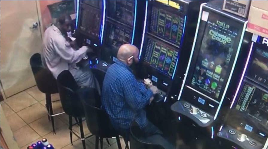 Authorities in Atlanta are searching for a suspect they say stole $7,900 from a gambling machine