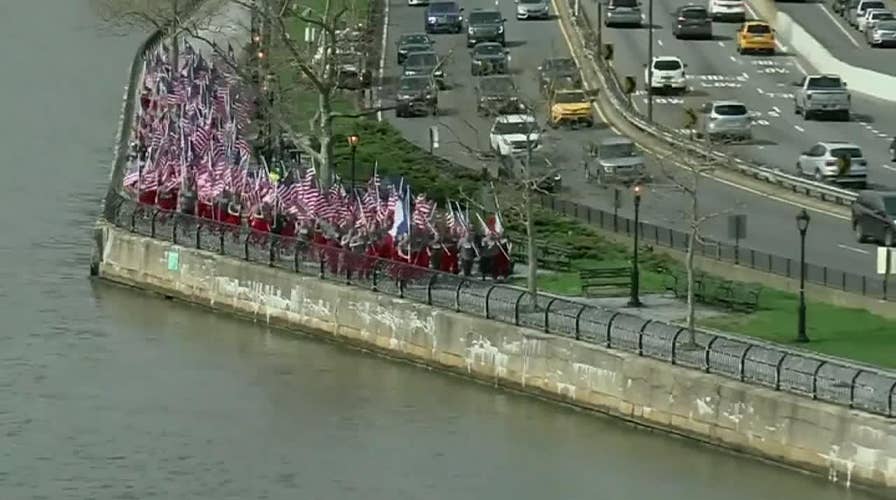 New York firefighters run with french flags in tribute to Notre Dame crews