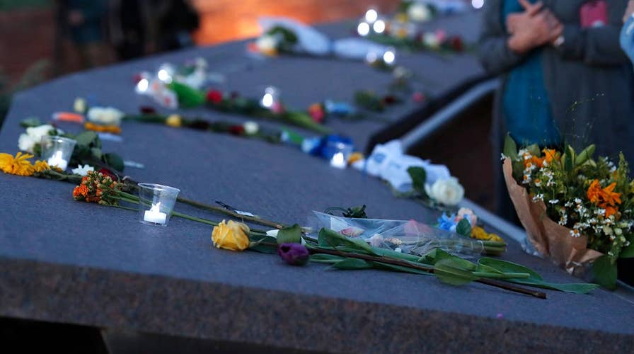 Mourners pay their respects on the twentieth anniversary of the Columbine shooting