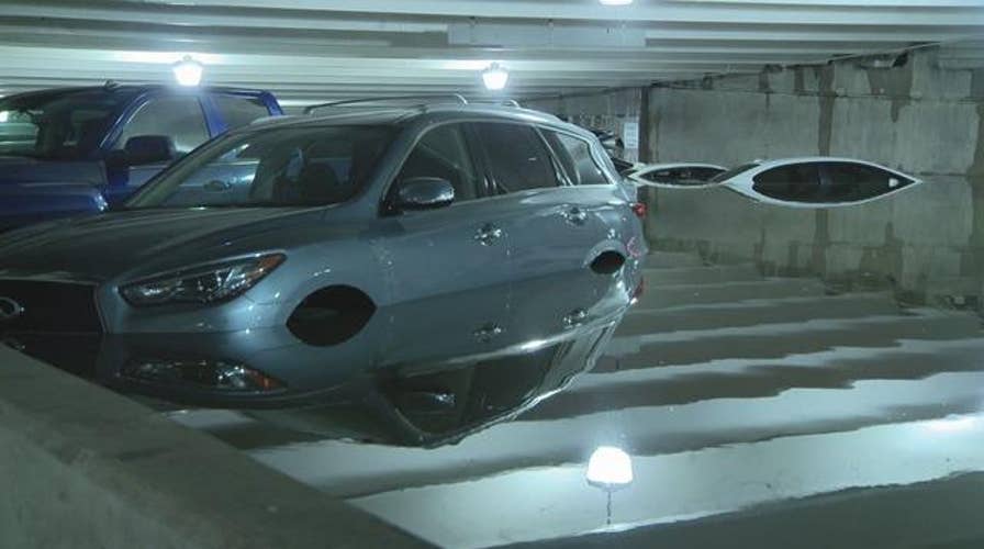 Heavy rain wreaks havoc on Dallas airport parking lot