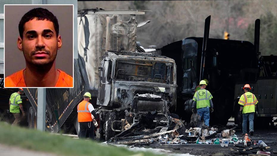 Semitruck driver, 23, arrested after 4 people are killed