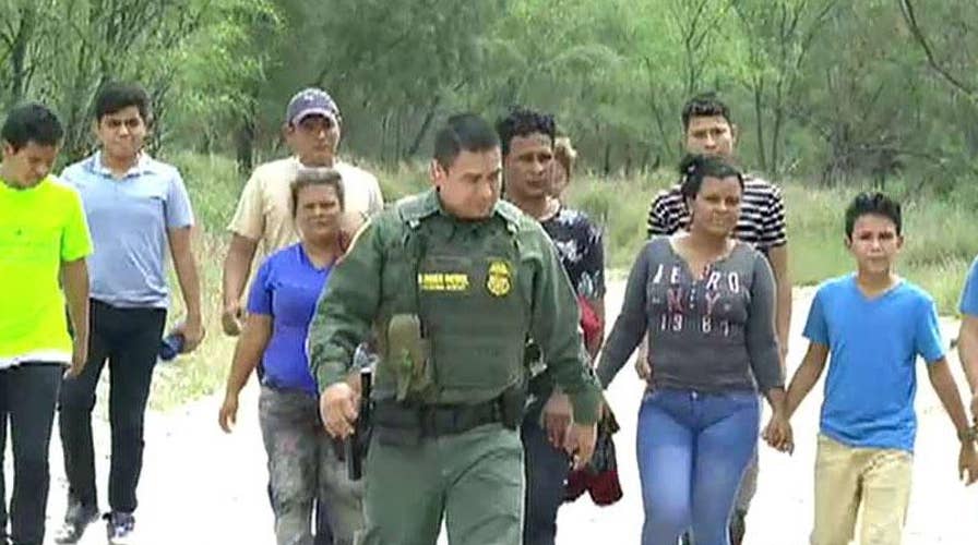 Smugglers ferry Central American migrants across the Rio Grande