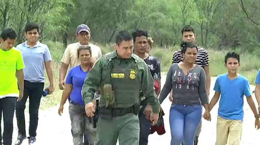 Smugglers ferry Central American migrants across the Rio Grande