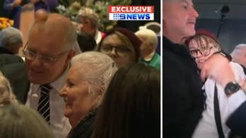 Australian prime minister attacked with egg by protester at election event