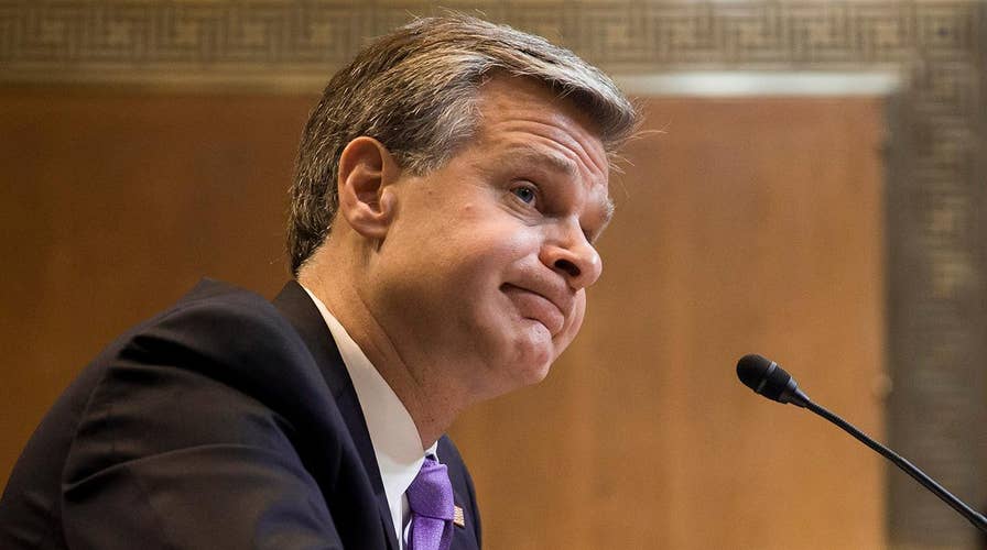 Christopher Wray on if the FBI engages in spying: 'That's not the term I would use'