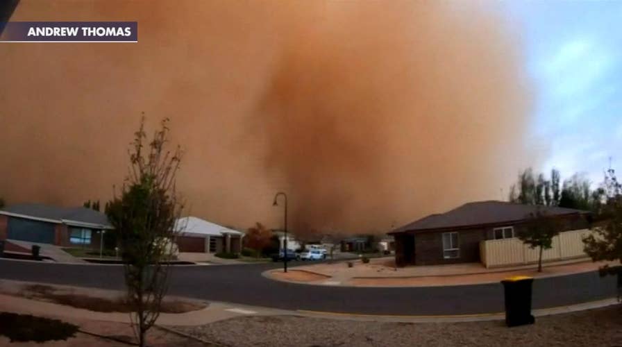 Dust storm rolls in over Australian town, plunging it into darkness