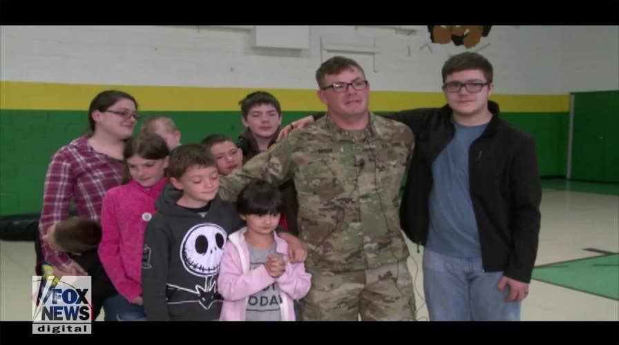 Soldier surprises his kids at school with early homecoming