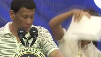 President Rodrigo Duterte of the Philippines gets interrupted by a cockroach during rally