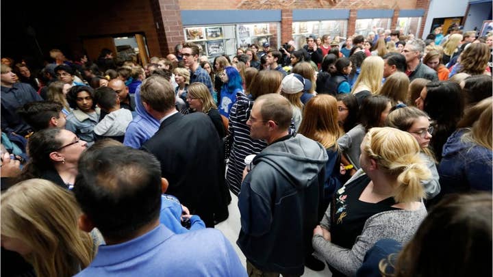 Colorado students walk out of school shooting vigil