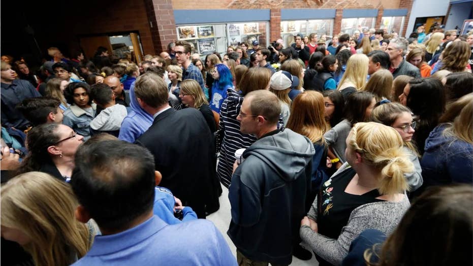 Colorado students walk out of school shooting vigil