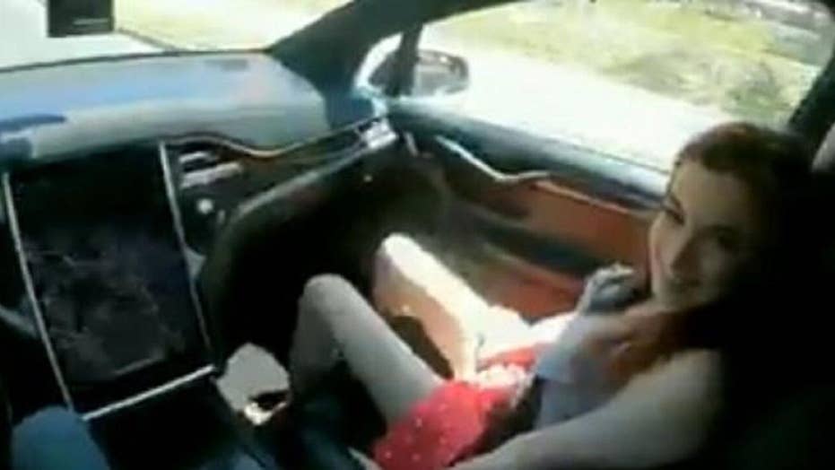 Police pull over driver watching 'sexy' video behind the wheel ...