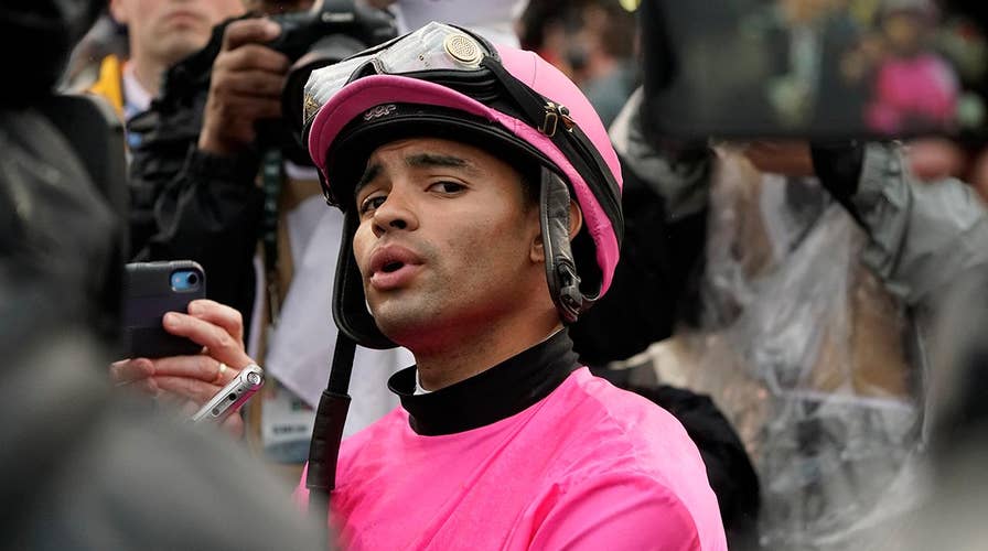 Disqualified Kentucky Derby jockey temporarily suspended