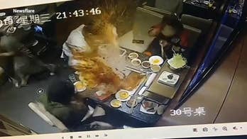 Horrifying footage shows boiling soup exploding in waitress' face at hot pot restaurant