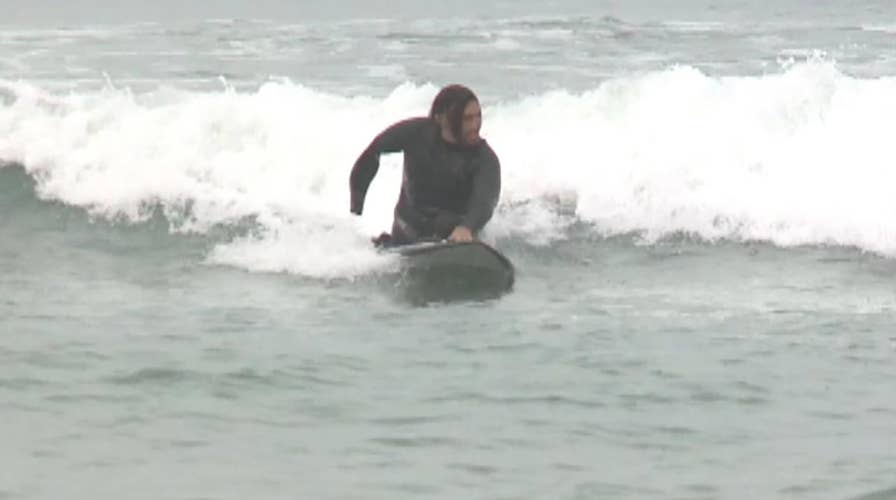 US veteran with no legs, one arm plans to compete in Hawaii surfing competition